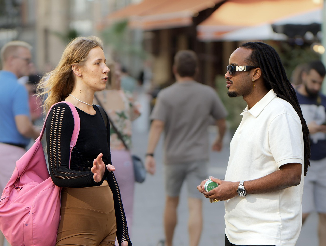 A woman and a man talking in the street